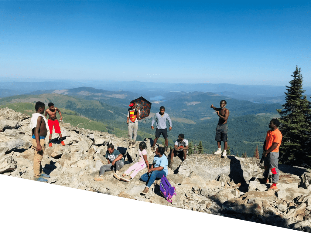 An image of teens gathered along a mountaintop for the World Relief Hike.