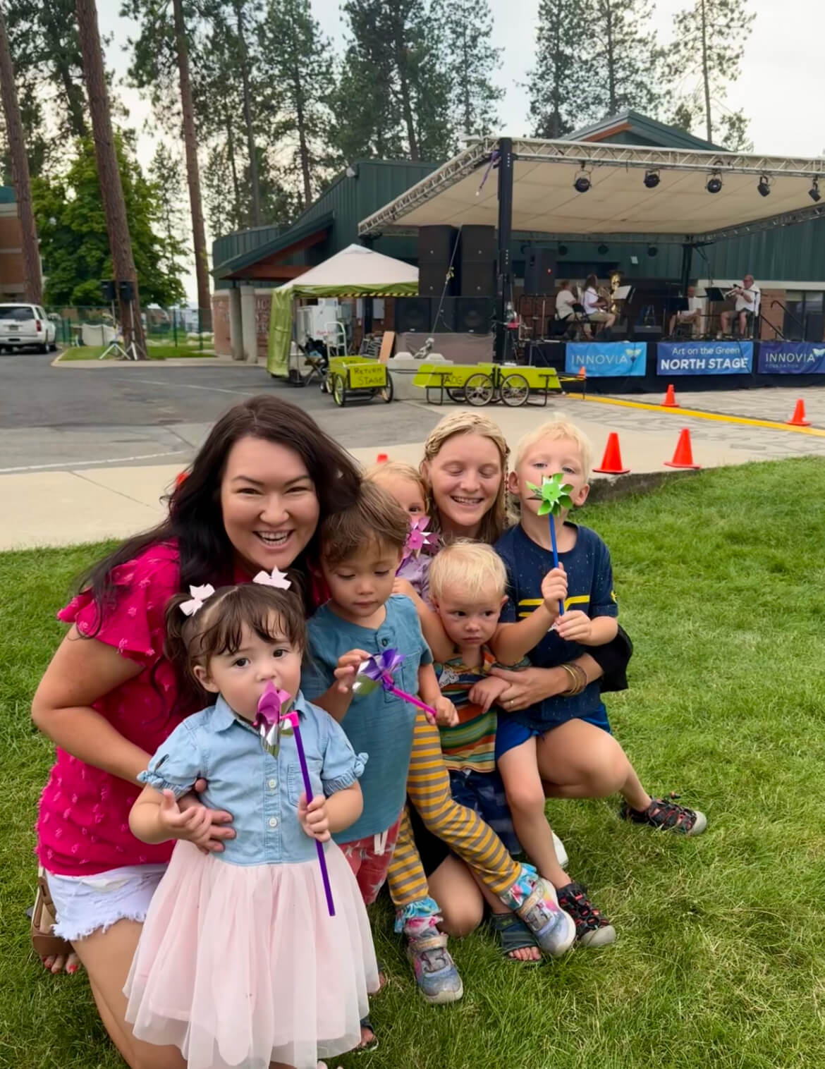 Family enjoys pinwheels at outdoor concert