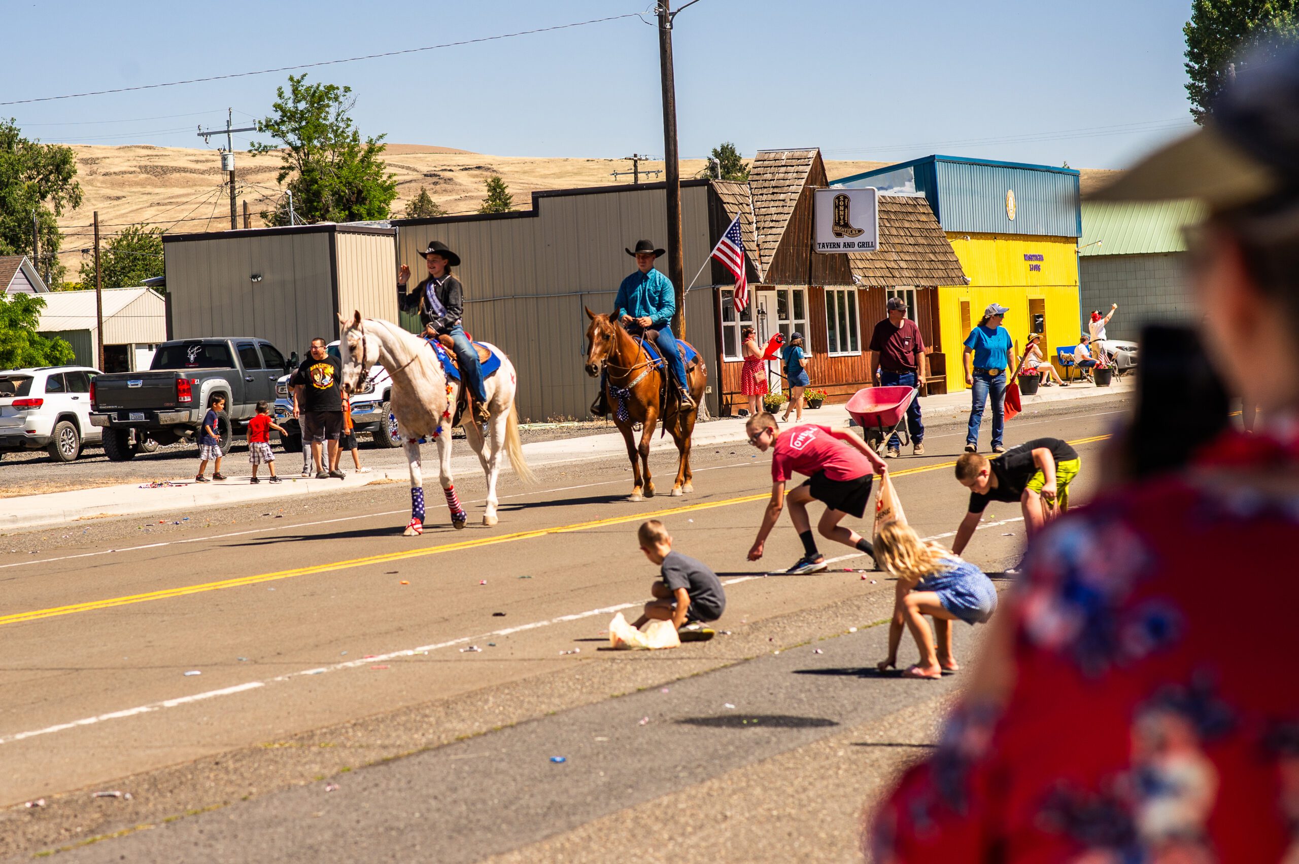 People riding horses in a parade