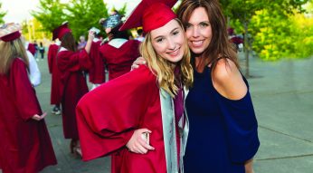Happy and proud Mother with high school graduate Daughter