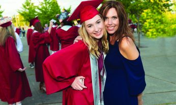 Happy and proud Mother with high school graduate Daughter